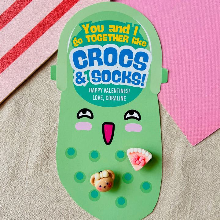 Cute green printable Croc charms organizer card saying "You and I Go Together Like Crocs & Socks" with Jibbitz for kids' Valentines