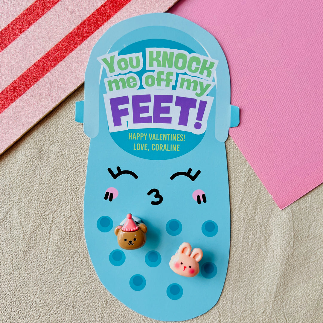 Blue printable Croc charm Valentine holder with "You Knock Me Off My Feet!" text and Jibbitz for fun school exchanges
