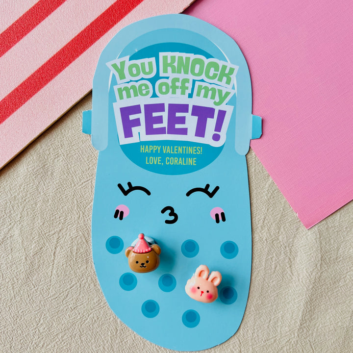 Blue printable Croc charm Valentine holder with "You Knock Me Off My Feet!" text and Jibbitz for fun school exchanges