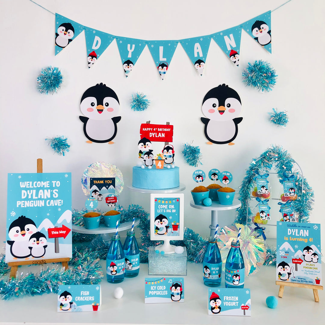 Penguin-themed birthday setup with cake and decorations