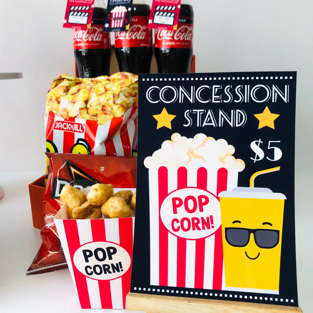 Concession stand sign with popcorn and snacks display