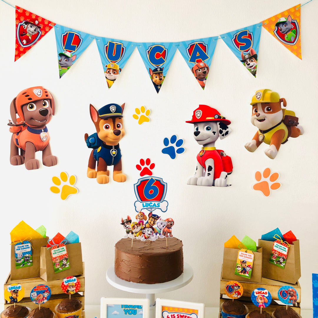 Paw Patrol birthday party setup with cake and banners